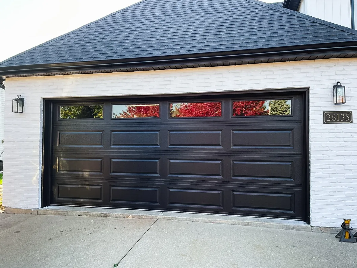 Modern flush-panel residential garage door